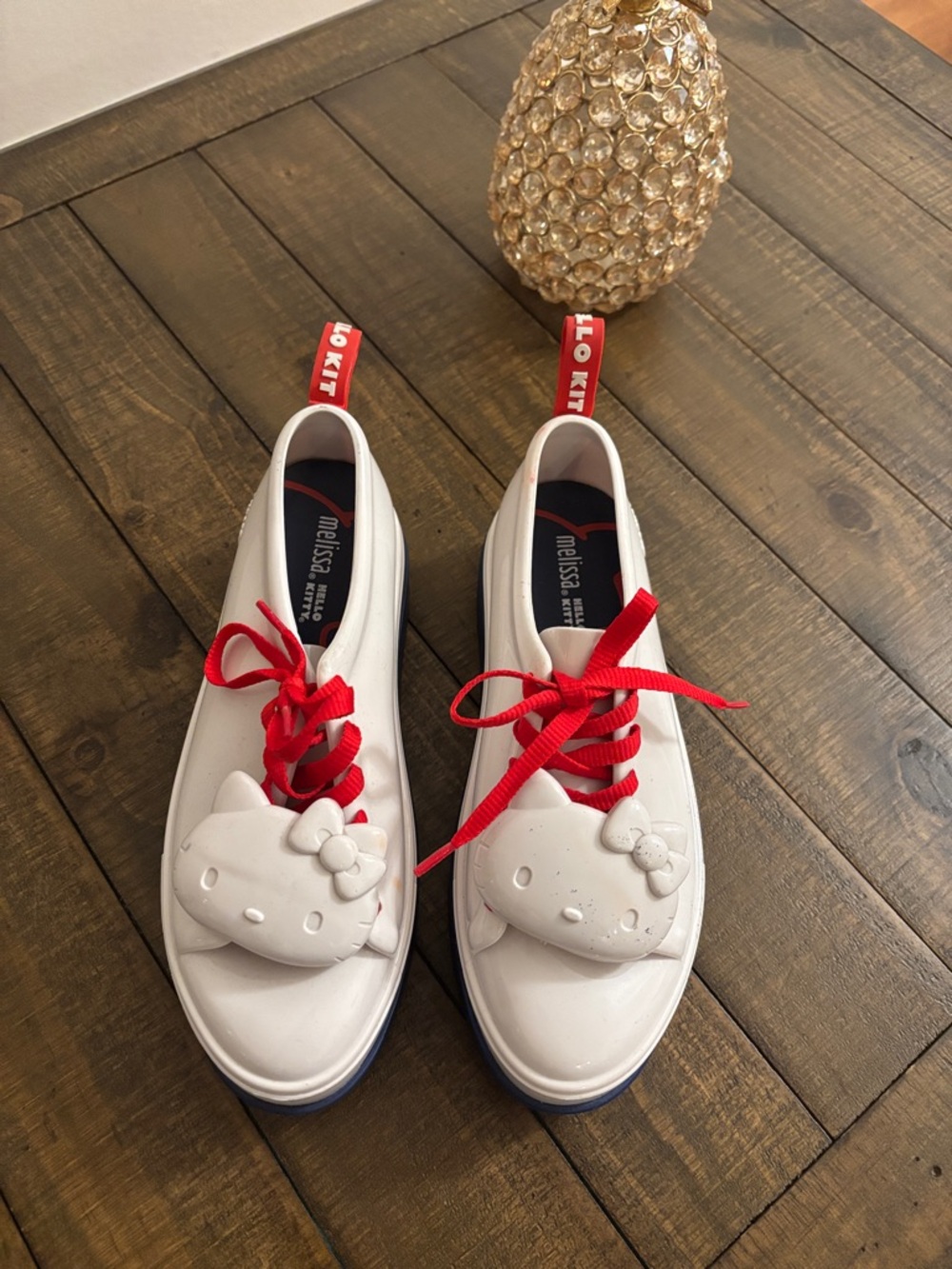 Melissa White Kids Sneakers with Red Laces and Hello Kitty Detail